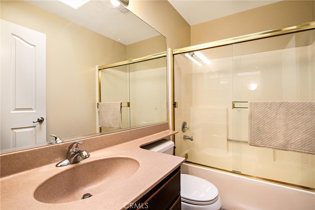7267 Corbin Avenue, Unit M Winnetka, CA 91306 - Photo 20 of 28 a bathroom with a sink and a mirror