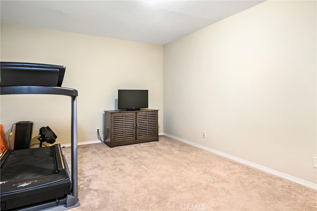 7267 Corbin Avenue, Unit M Winnetka, CA 91306 - Photo 22 of 28 a bedroom with a bed and dresser