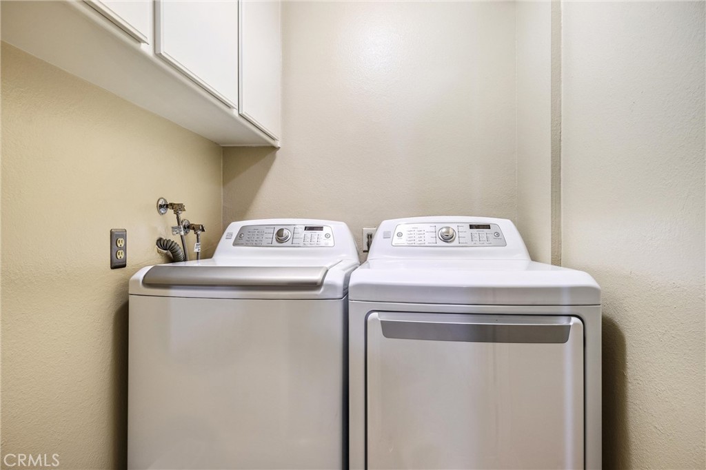 7267 Corbin Avenue, Unit M Winnetka, CA 91306 - Photo 23 of 28 a utility room with dryer and washer