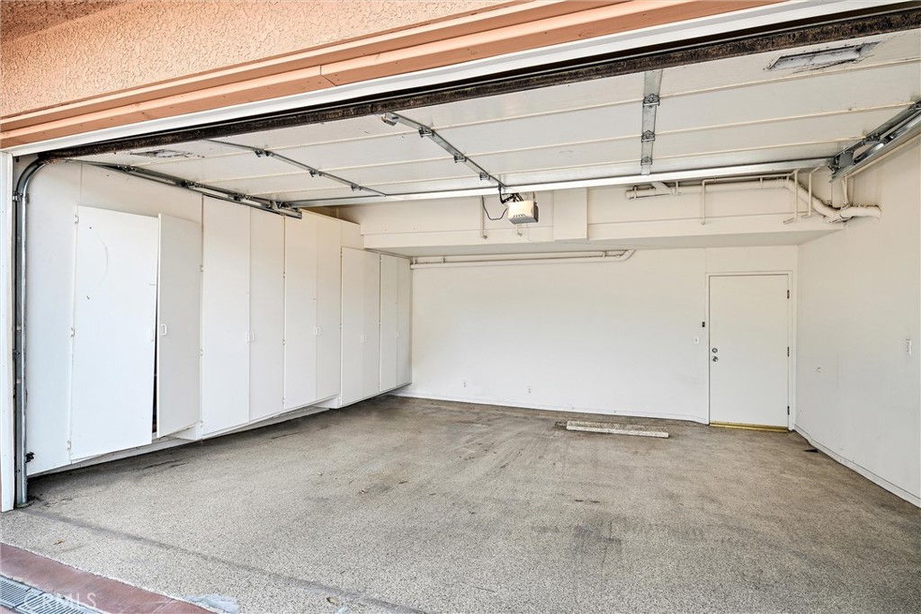 7267 Corbin Avenue, Unit M Winnetka, CA 91306 - Photo 25 of 28 a view of a room with racks on the wall