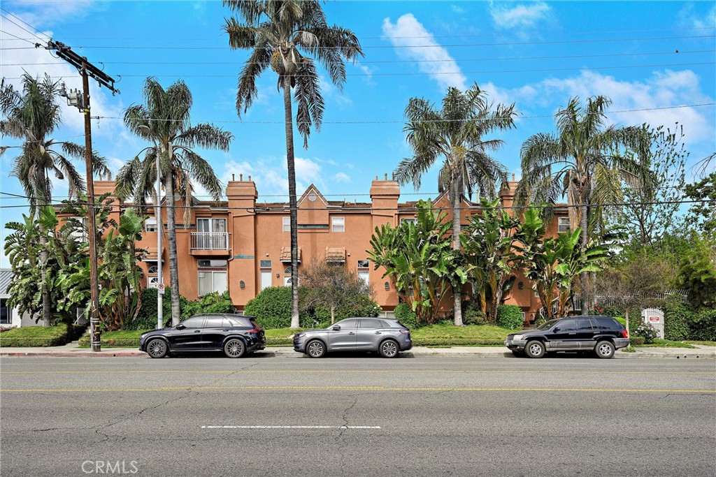 7267 Corbin Avenue, Unit M Winnetka, CA 91306 - Photo 28 of 28 a car parked on the side of a street