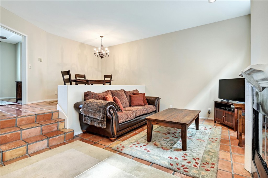 7267 Corbin Avenue, Unit M Winnetka, CA 91306 - Photo 3 of 28 a living room with furniture and a flat screen tv