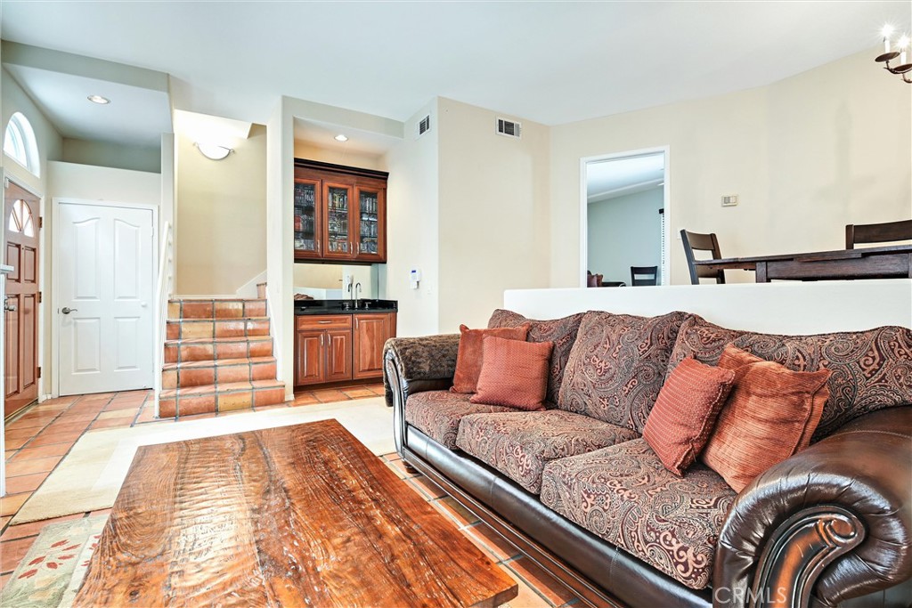 7267 Corbin Avenue, Unit M Winnetka, CA 91306 - Photo 4 of 28 a living room with furniture and cabinets