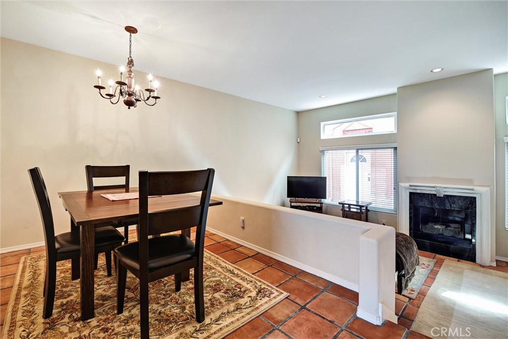 7267 Corbin Avenue, Unit M Winnetka, CA 91306 - Photo 6 of 28 a view of a livingroom with furniture fireplace and a chandelier
