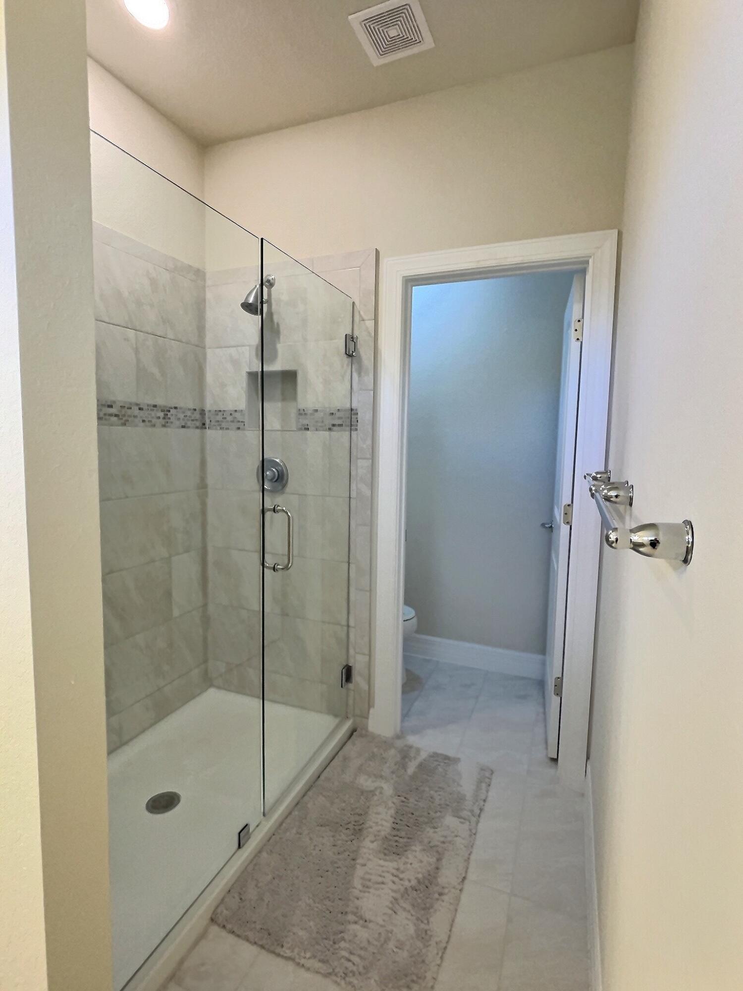 4829 Chantilly Road Lake Worth, FL 33467 - Photo 12 of 31 a bathroom with a shower