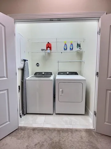 a utility room with washer and dryer