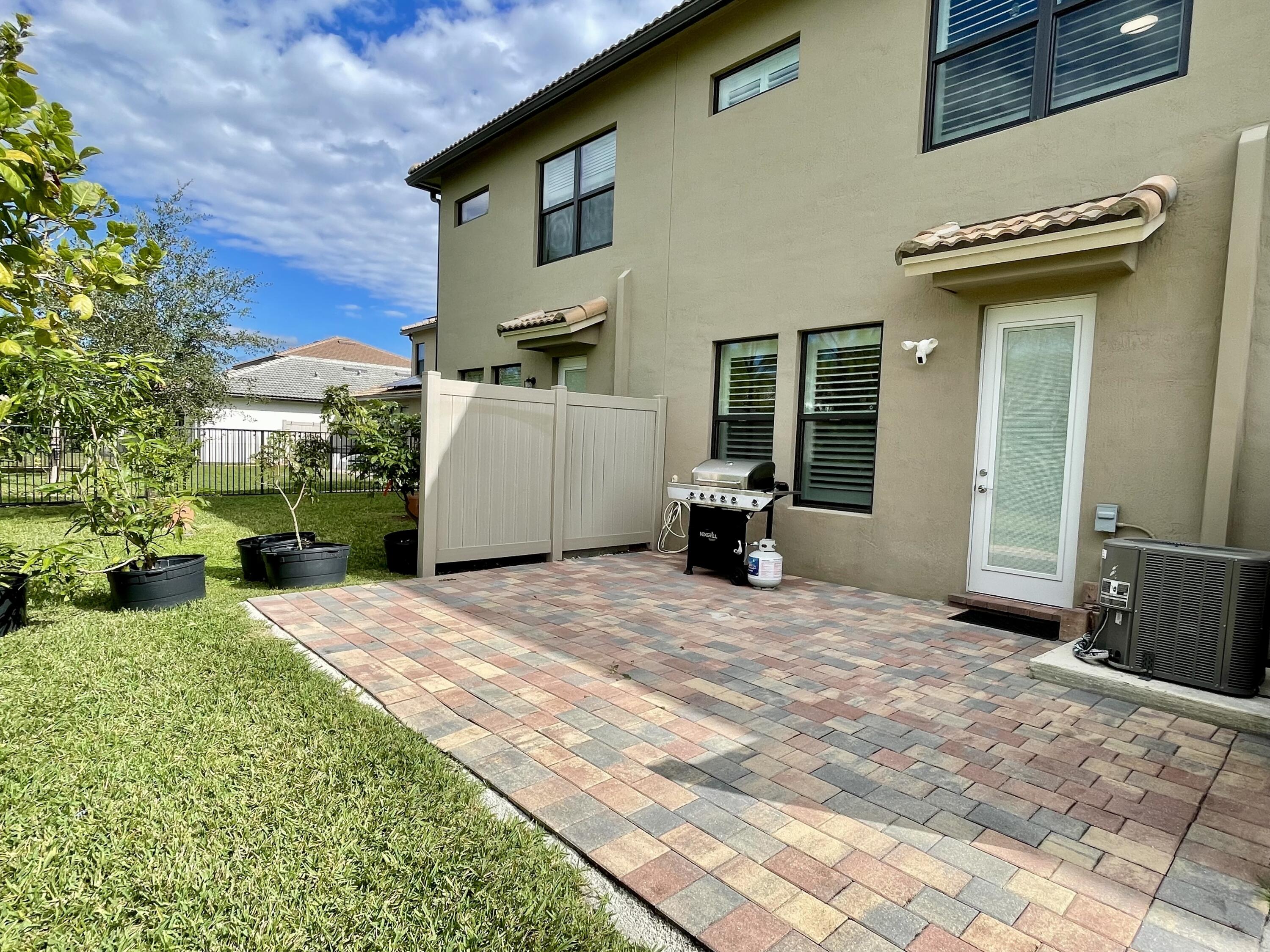 4829 Chantilly Road Lake Worth, FL 33467 - Photo 22 of 31 a view of a house with backyard and sitting area