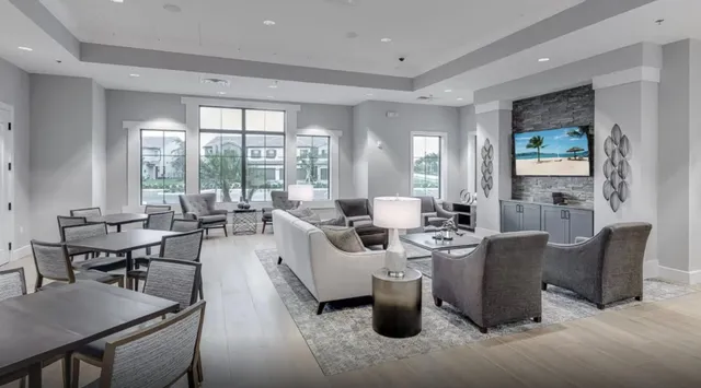 a view of a swimming pool with outdoor seating