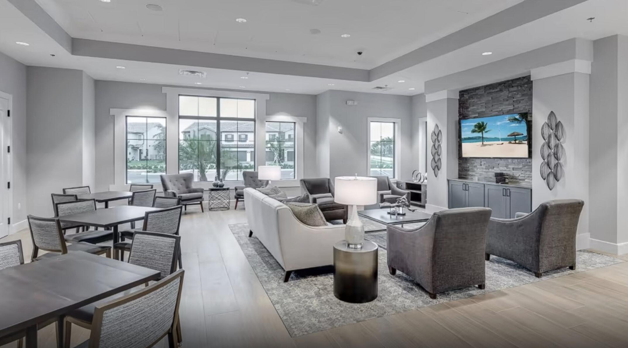 4829 Chantilly Road Lake Worth, FL 33467 - Photo 25 of 31 a living room with lots of white furniture and a large window