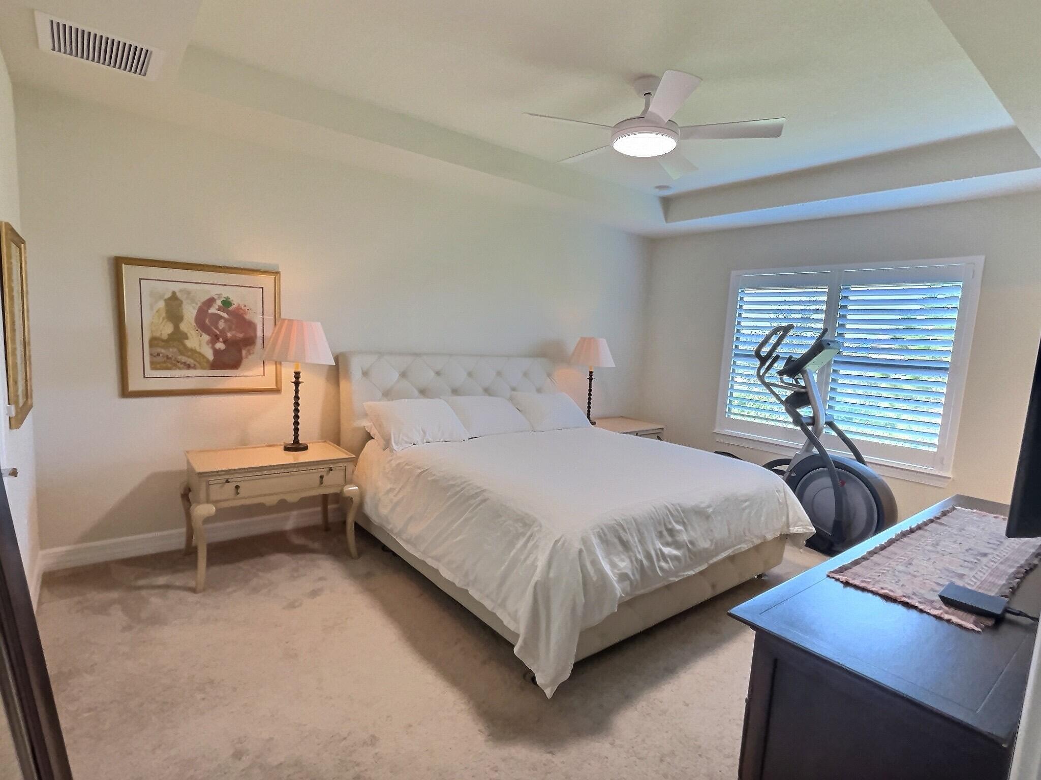 4829 Chantilly Road Lake Worth, FL 33467 - Photo 8 of 31 a bedroom with bed and a window