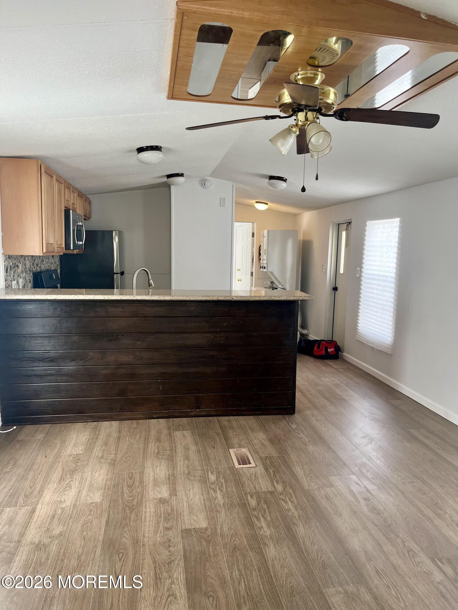 58 Ron Road Hazlet, NJ 07730 - Photo 6 of 9 a view of kitchen and hall with wooden floor