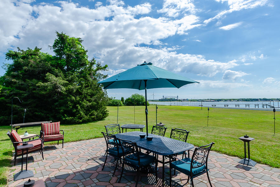 42 Robinwood Road Buzzards Bay, MA 02532 - Photo 11 of 39 an outdoor space with furniture and umbrella