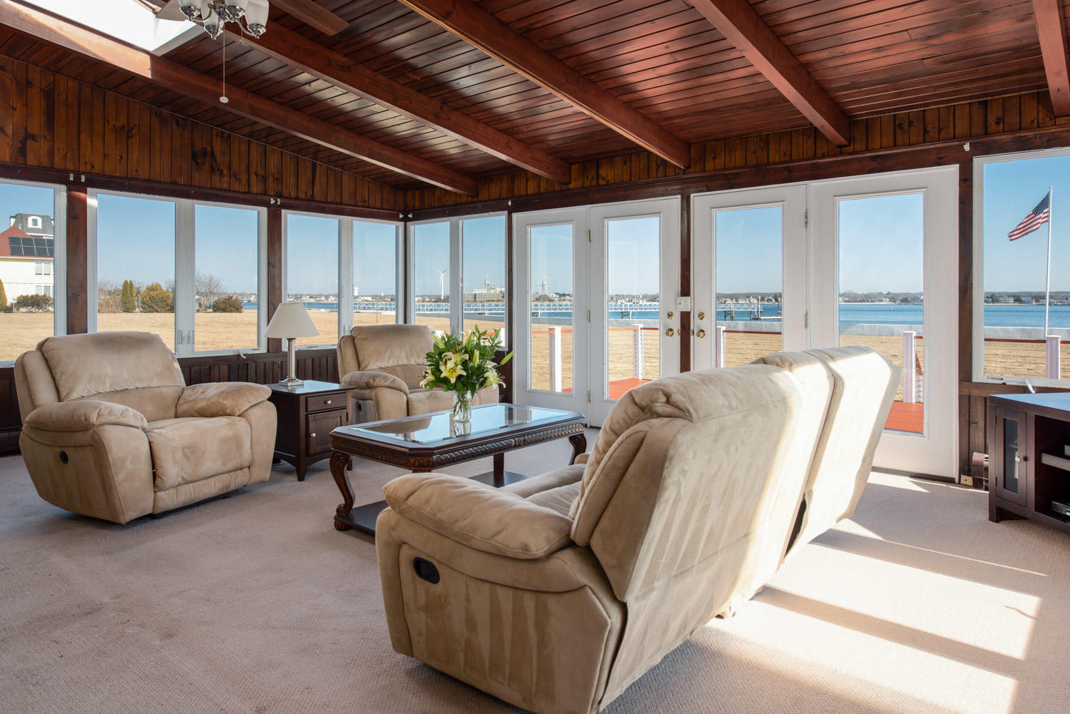 42 Robinwood Road Buzzards Bay, MA 02532 - Photo 14 of 39 a living room with furniture a flat screen tv and a large window