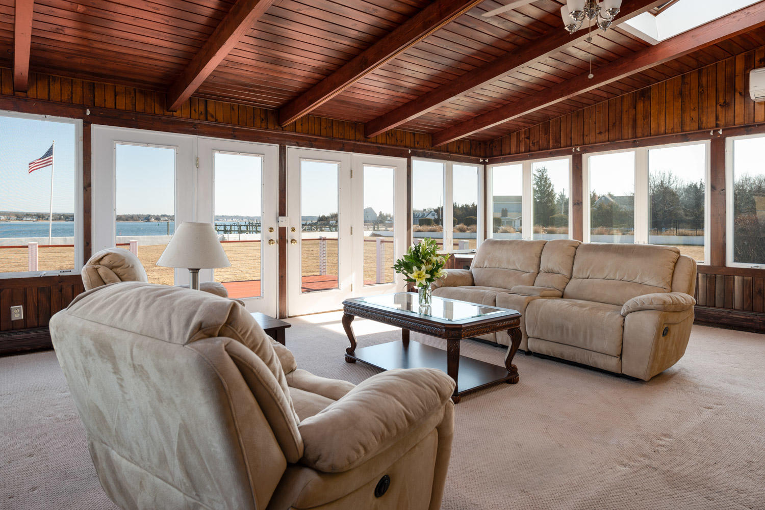 42 Robinwood Road Buzzards Bay, MA 02532 - Photo 15 of 39 a living room with furniture a wooden floor and a large window