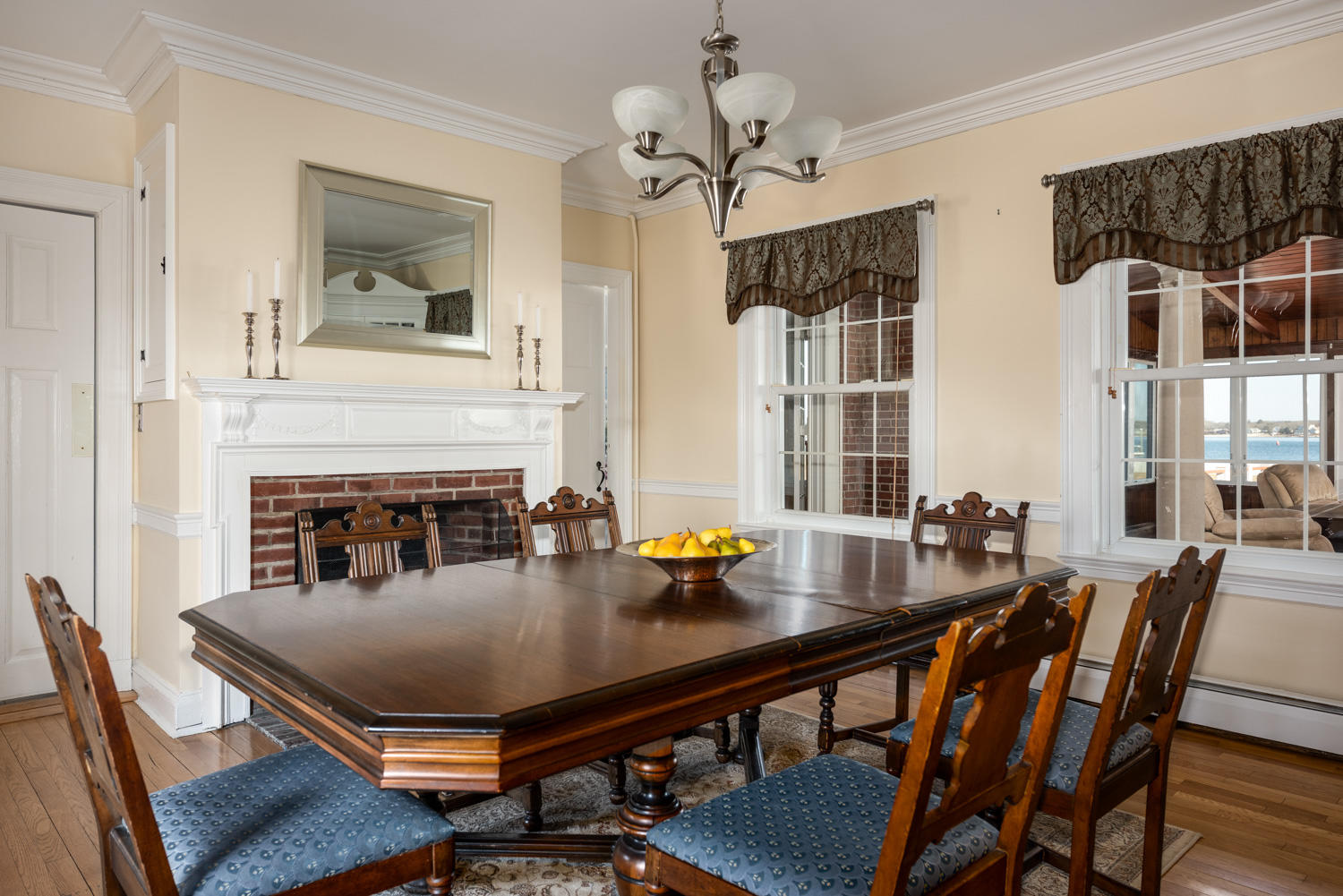 42 Robinwood Road Buzzards Bay, MA 02532 - Photo 18 of 39 a view of a dining room with furniture and a fireplace