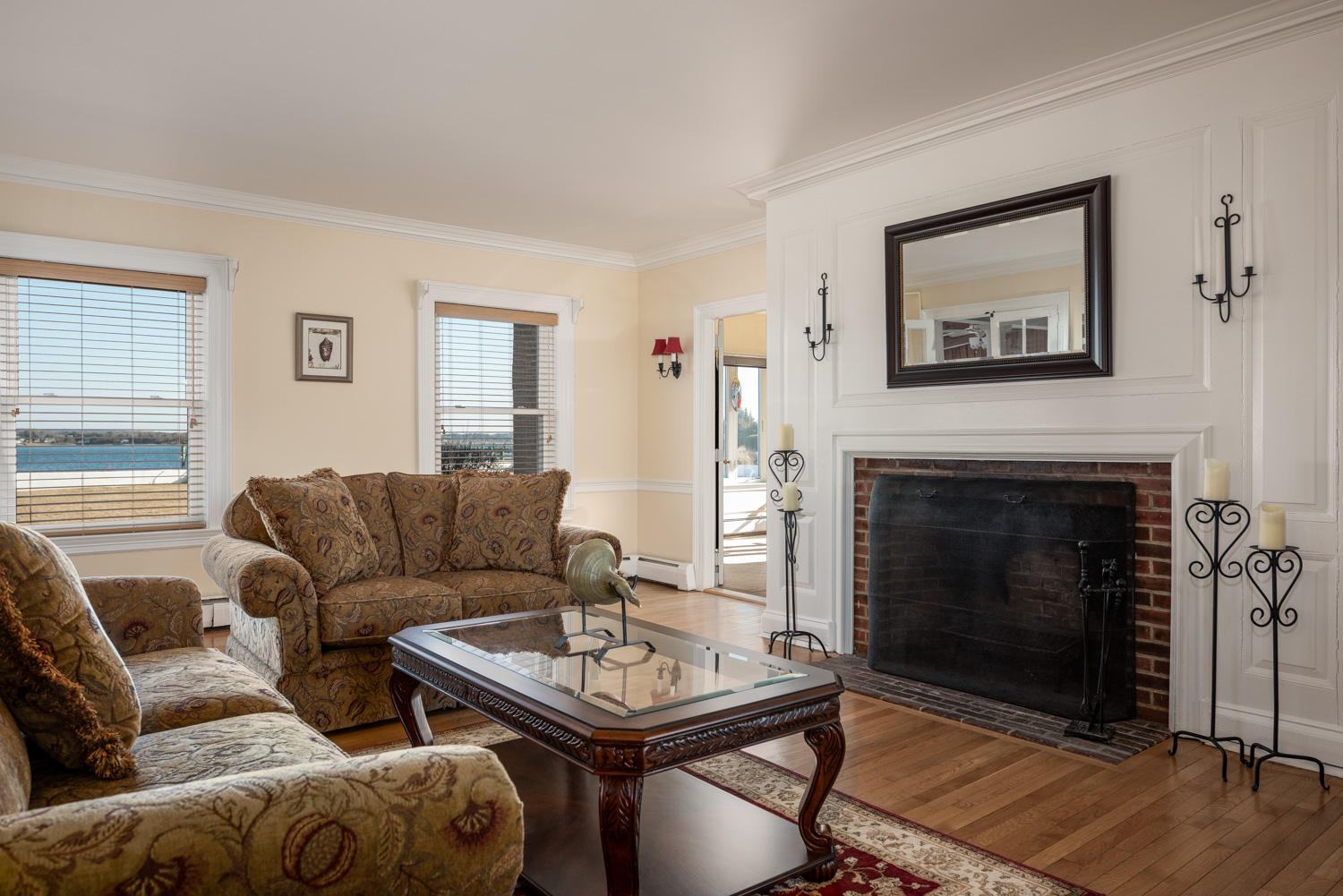 42 Robinwood Road Buzzards Bay, MA 02532 - Photo 19 of 39 a living room with furniture a flat screen tv and a fireplace