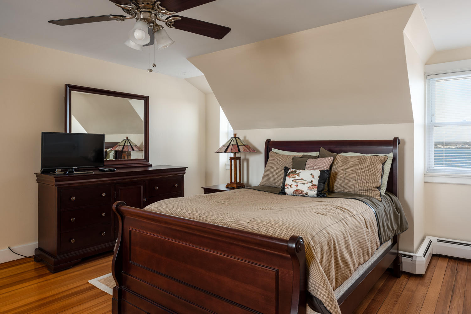 42 Robinwood Road Buzzards Bay, MA 02532 - Photo 22 of 39 a bedroom with a bed and wooden floor
