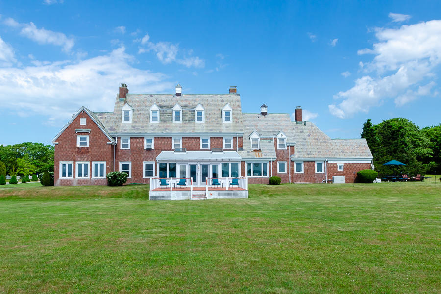 42 Robinwood Road Buzzards Bay, MA 02532 - Photo 6 of 39 a view of a big yard with large trees and a big yard
