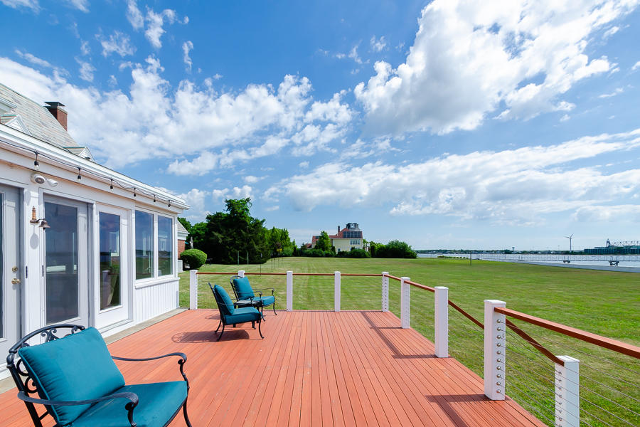 42 Robinwood Road Buzzards Bay, MA 02532 - Photo 9 of 39 a view of a chair and table on the terrace