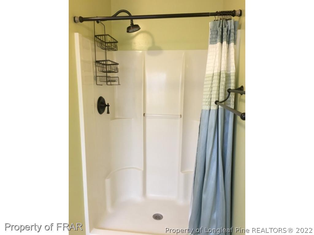 1065 Roundabout Road Cameron, NC 28326 - Photo 17 of 25 a bathroom with a shower