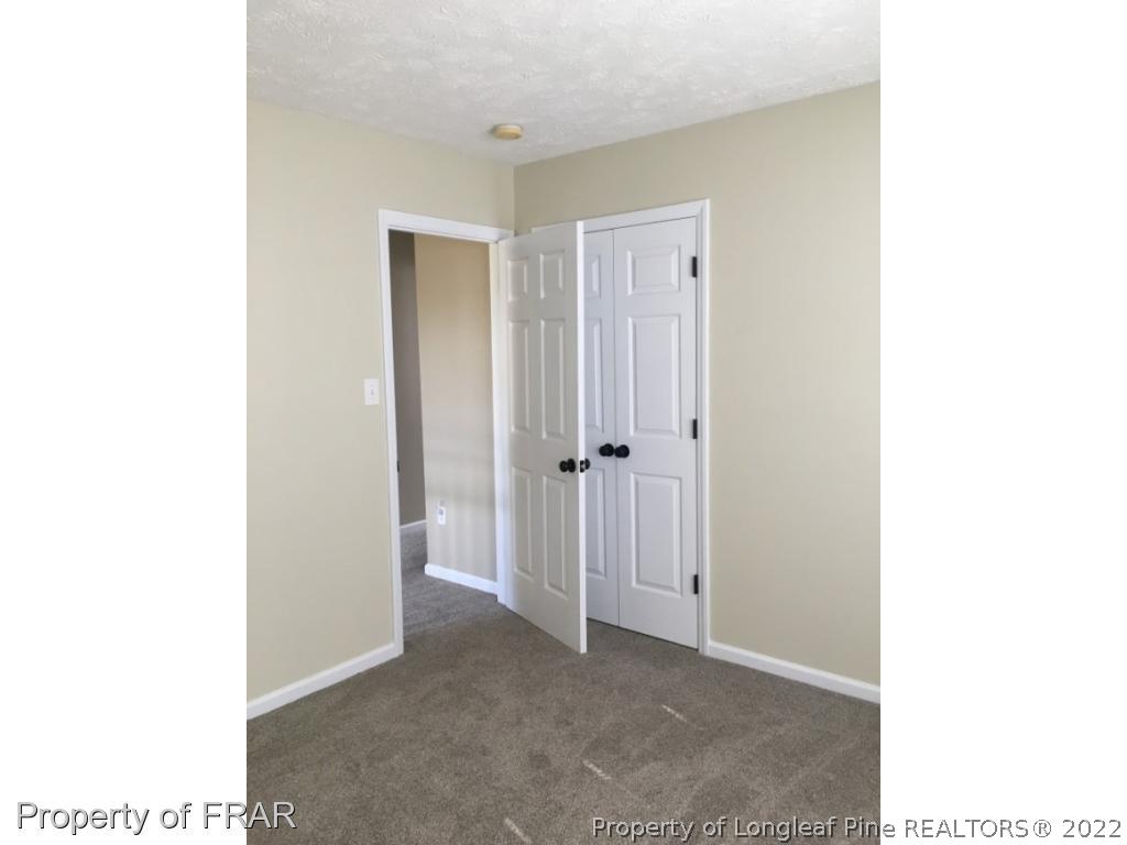 1065 Roundabout Road Cameron, NC 28326 - Photo 18 of 25 a view of a hallway with closet