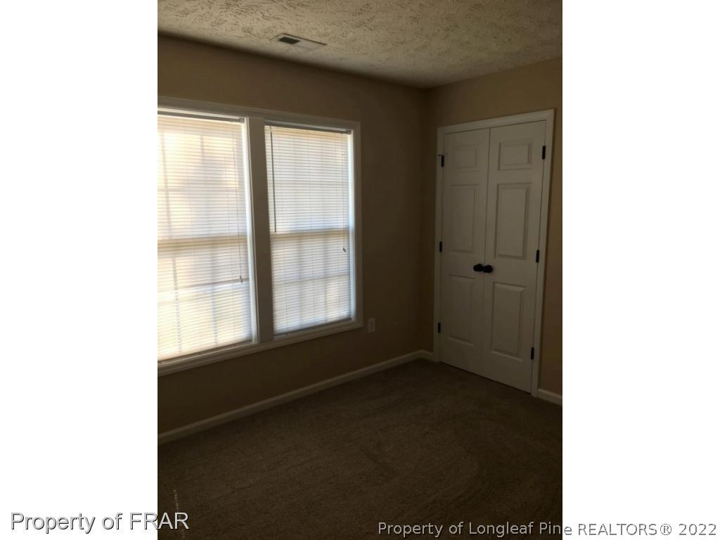 1065 Roundabout Road Cameron, NC 28326 - Photo 20 of 25 a view of an empty room with a window