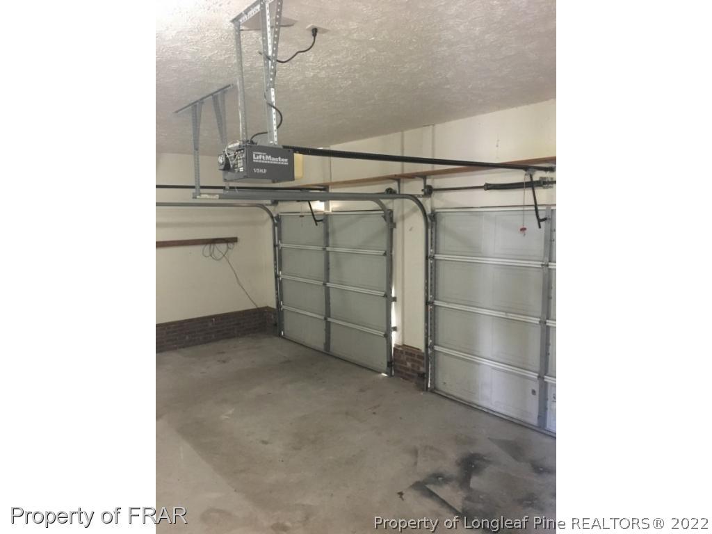 1065 Roundabout Road Cameron, NC 28326 - Photo 22 of 25 a view of a room with racks on the wall