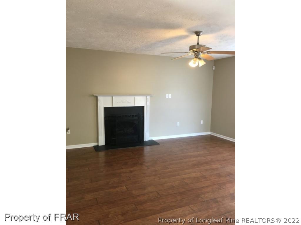 1065 Roundabout Road Cameron, NC 28326 - Photo 3 of 25 a view of empty room with a fireplace