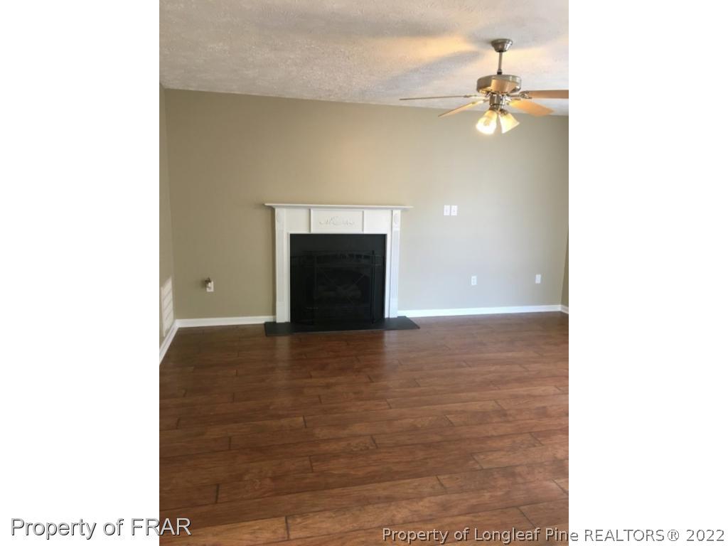 1065 Roundabout Road Cameron, NC 28326 - Photo 4 of 25 a view of a room with a fireplace