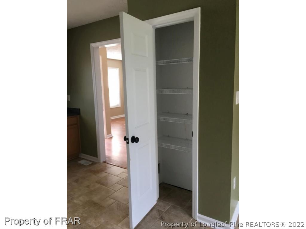 1065 Roundabout Road Cameron, NC 28326 - Photo 7 of 25 a view of an empty room with bathroom and a bathroom