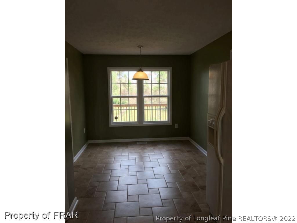 1065 Roundabout Road Cameron, NC 28326 - Photo 8 of 25 a view of an empty room with a window