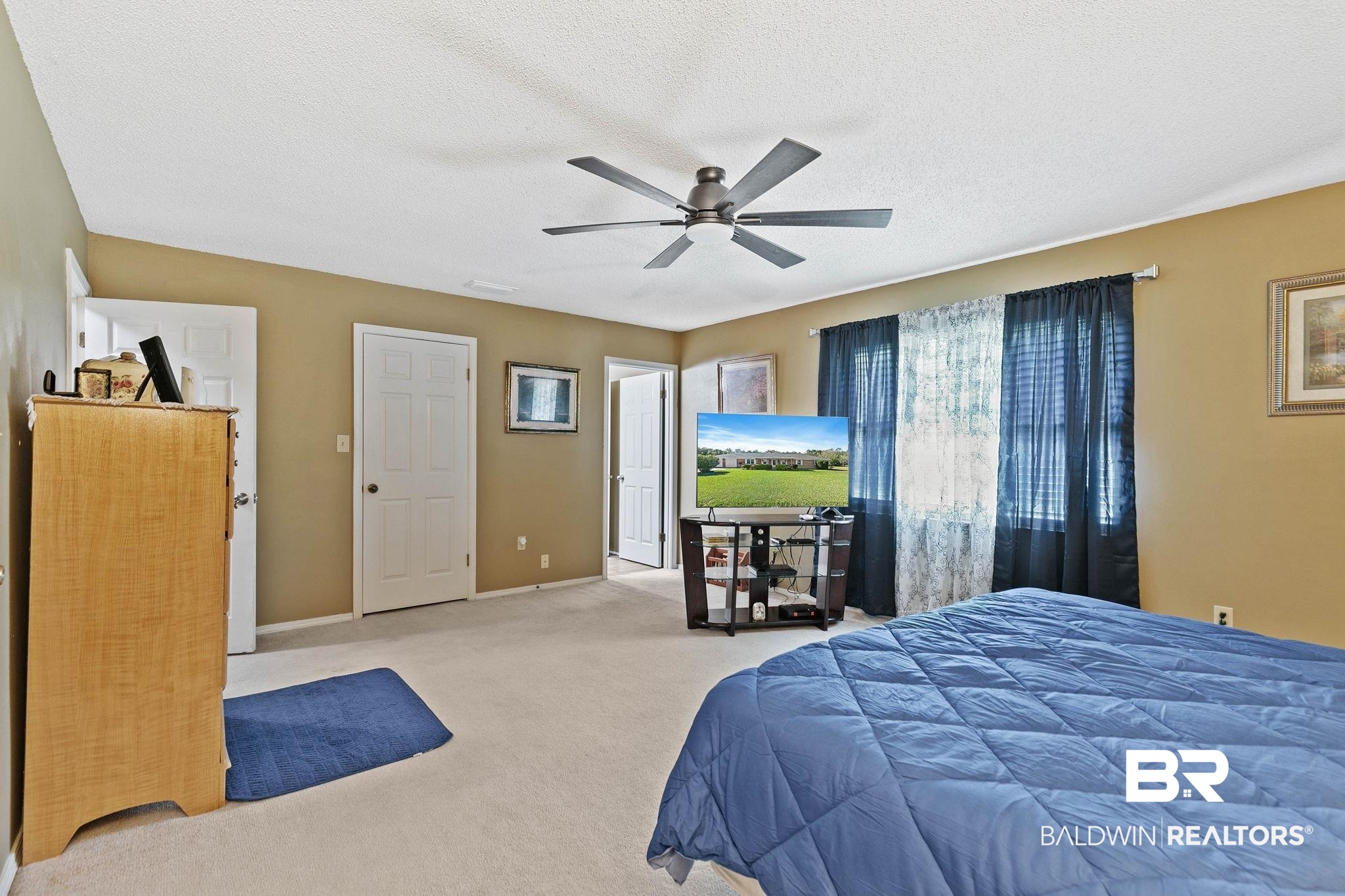1510 South Juniper Street Foley, AL 36535 - Photo 20 of 36 Bedroom featuring carpet flooring, a textured ceiling, and ceiling fan