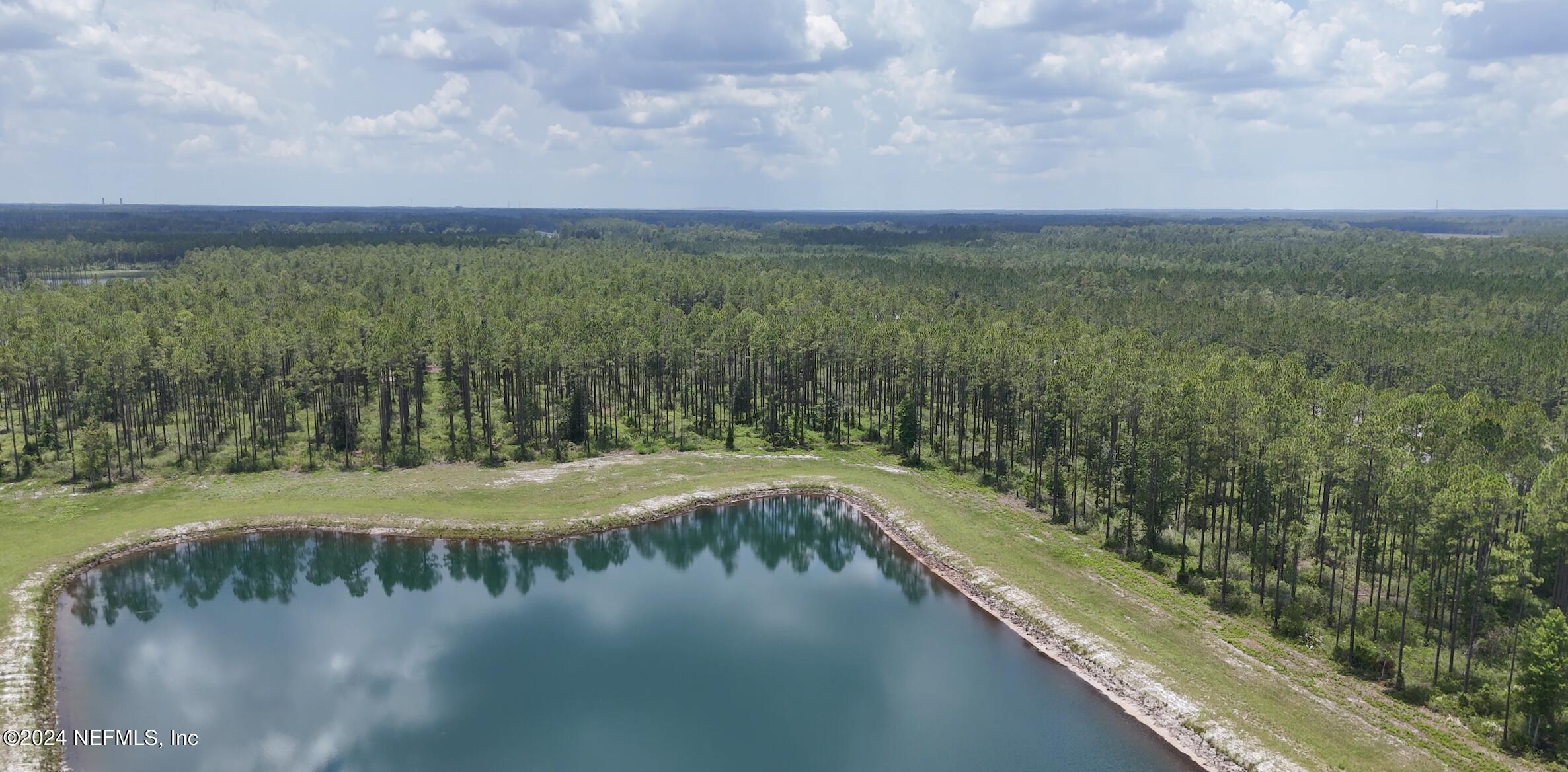 Lot 2 Us Highway Jacksonville, FL 32234 - Photo 3 of 12 a view of a lake from a yard