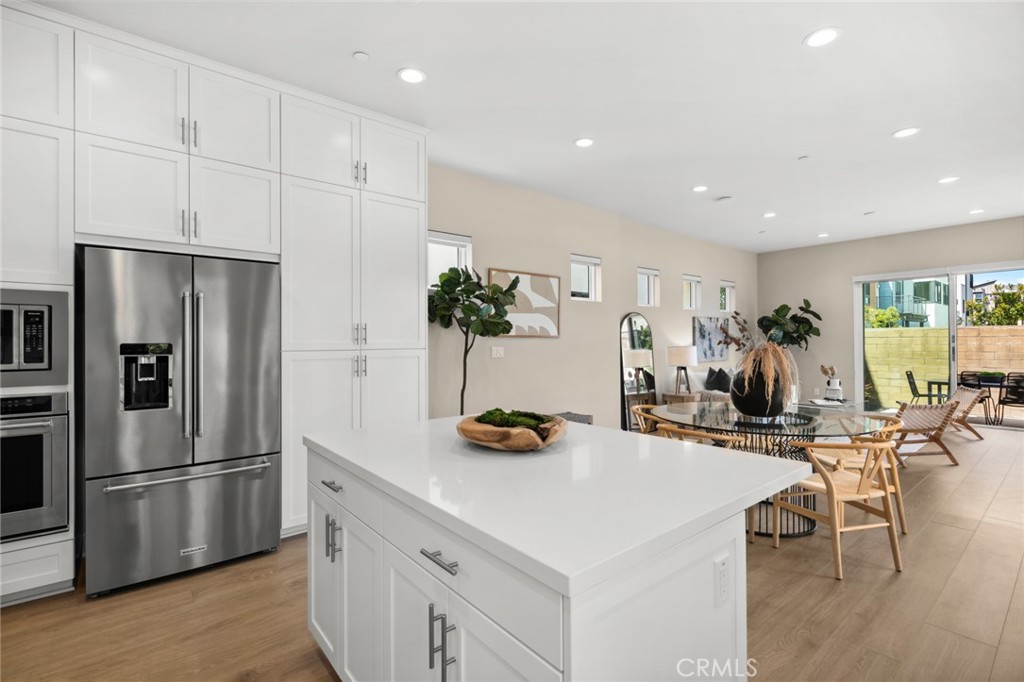 352 Novel Irvine, CA 92618 - Photo 13 of 75 a kitchen with stainless steel appliances kitchen island granite countertop a refrigerator and a stove