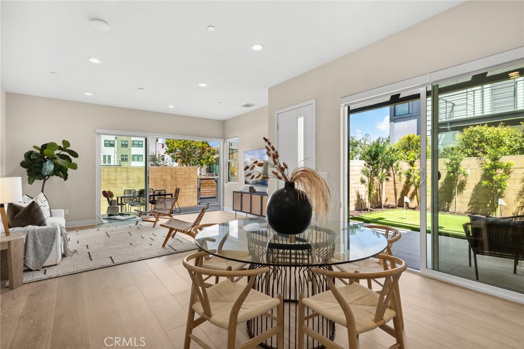 352 Novel Irvine, CA 92618 - Photo 16 of 75 a view of a dining room with furniture a chandelier and wooden floor