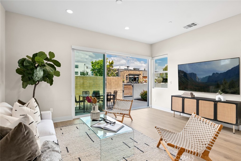 352 Novel Irvine, CA 92618 - Photo 18 of 75 a living room with furniture and a flat screen tv