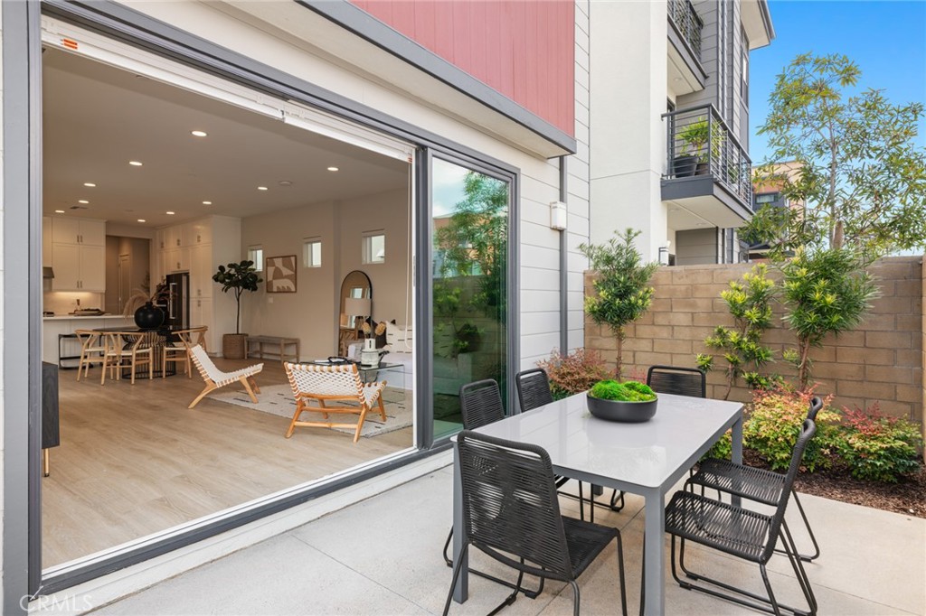 352 Novel Irvine, CA 92618 - Photo 21 of 75 a dining room with furniture and a floor to ceiling window