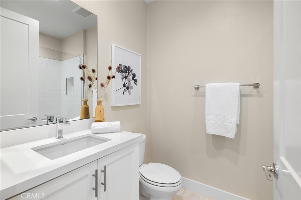 352 Novel Irvine, CA 92618 - Photo 22 of 75 a bathroom with a sink vanity mirror and toilet