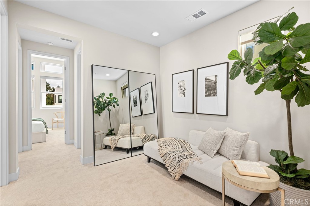 352 Novel Irvine, CA 92618 - Photo 26 of 75 a living room with furniture and a potted plant