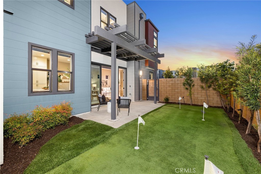352 Novel Irvine, CA 92618 - Photo 3 of 75 a front view of a house with a yard table and chairs