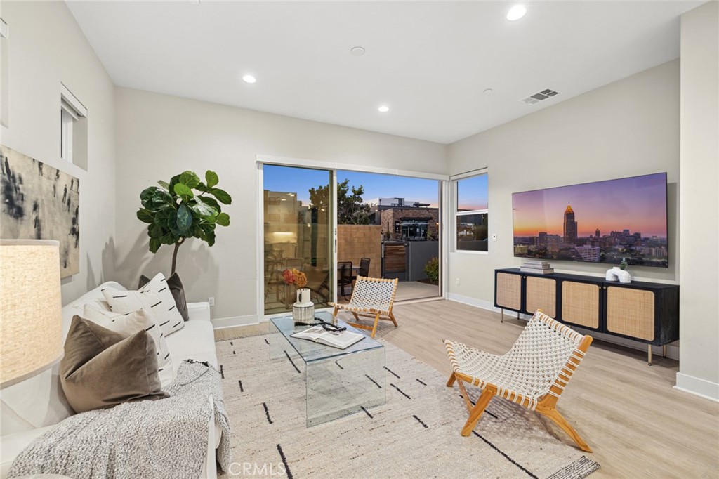 352 Novel Irvine, CA 92618 - Photo 6 of 75 a living room with furniture and potted plant