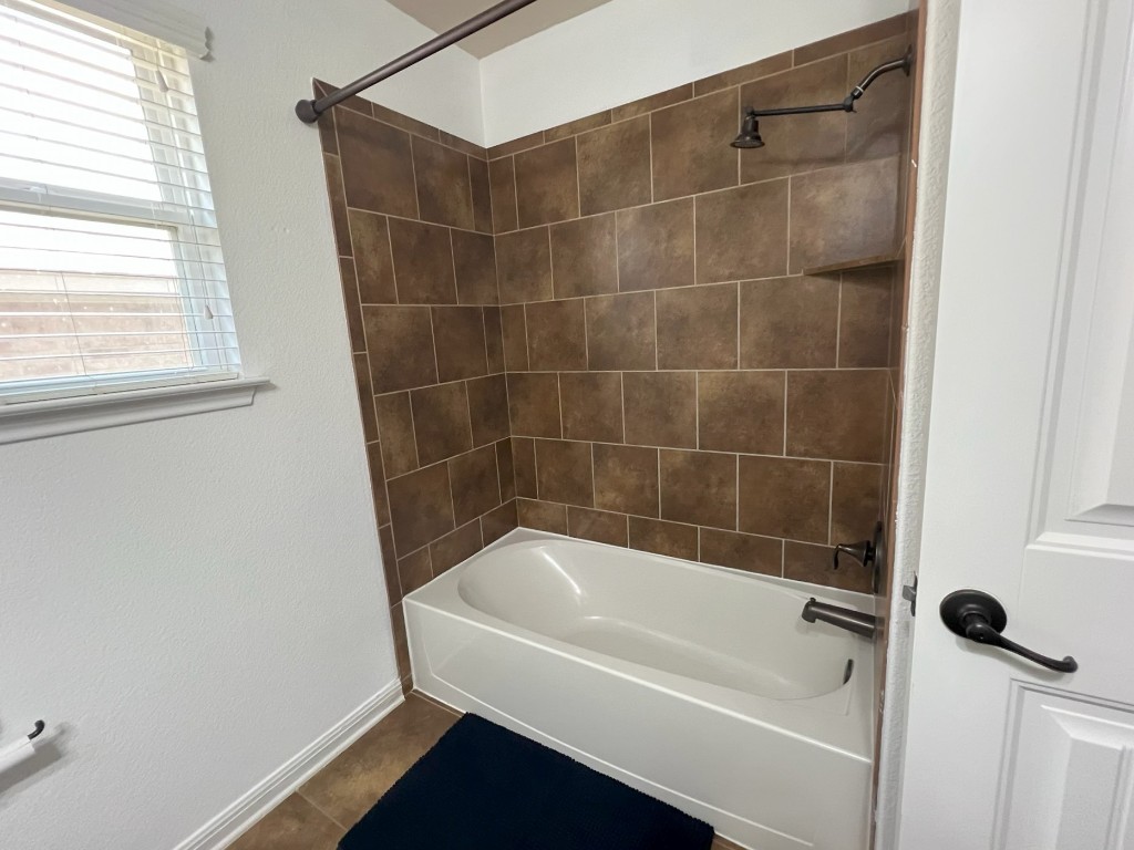 1711 Hidden Springs Path Round Rock, TX 78665 - Photo 24 of 39 a white bath tub sitting next to a shower