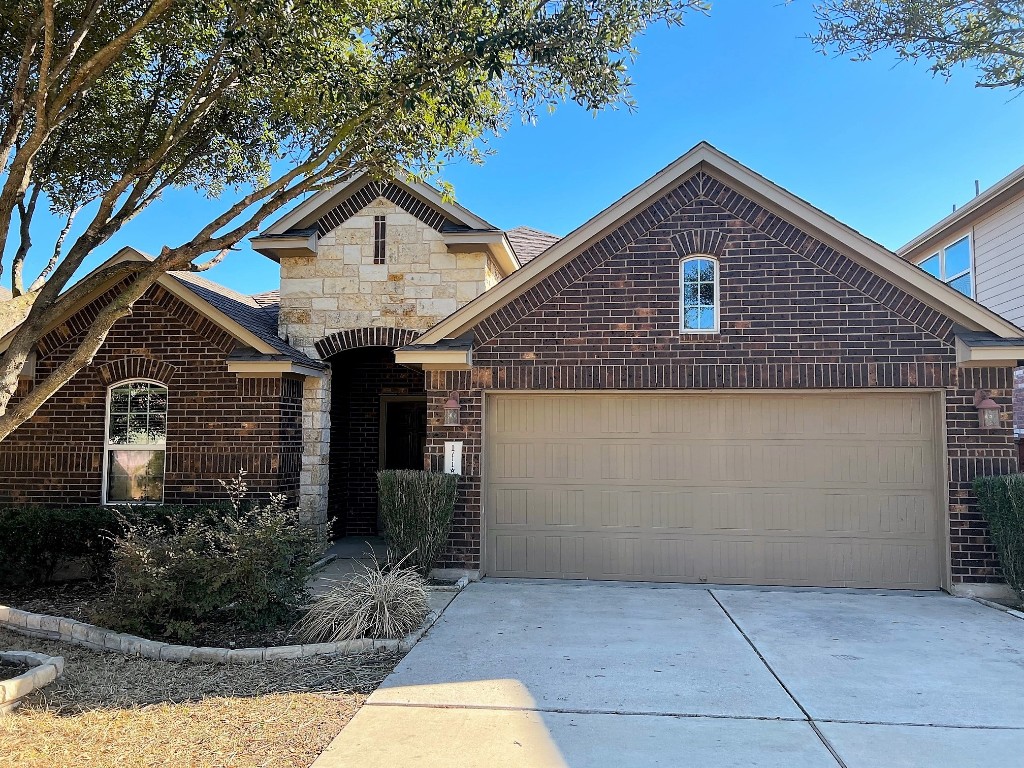 1711 Hidden Springs Path Round Rock, TX 78665 - Photo 32 of 39 a front view of a house with garden