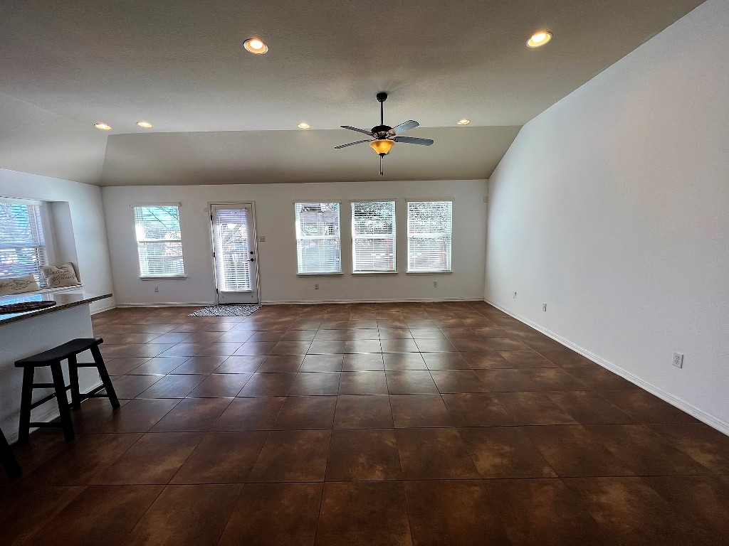1711 Hidden Springs Path Round Rock, TX 78665 - Photo 7 of 39 an empty room with wooden floor and windows