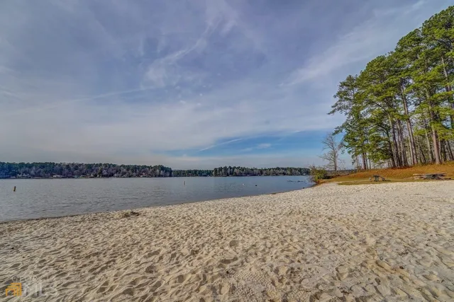 a view of a lake with houses in the back