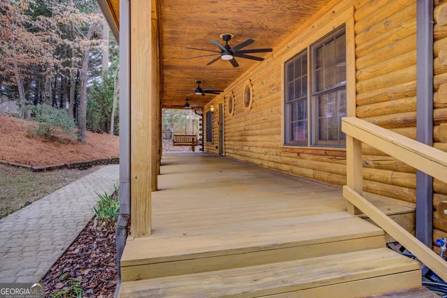 a view of a porch with wooden floor