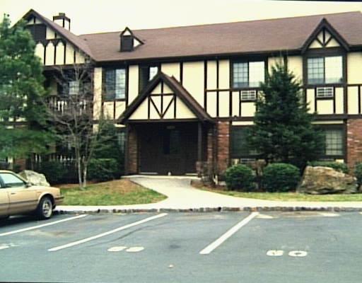 a view of a car park in front of house
