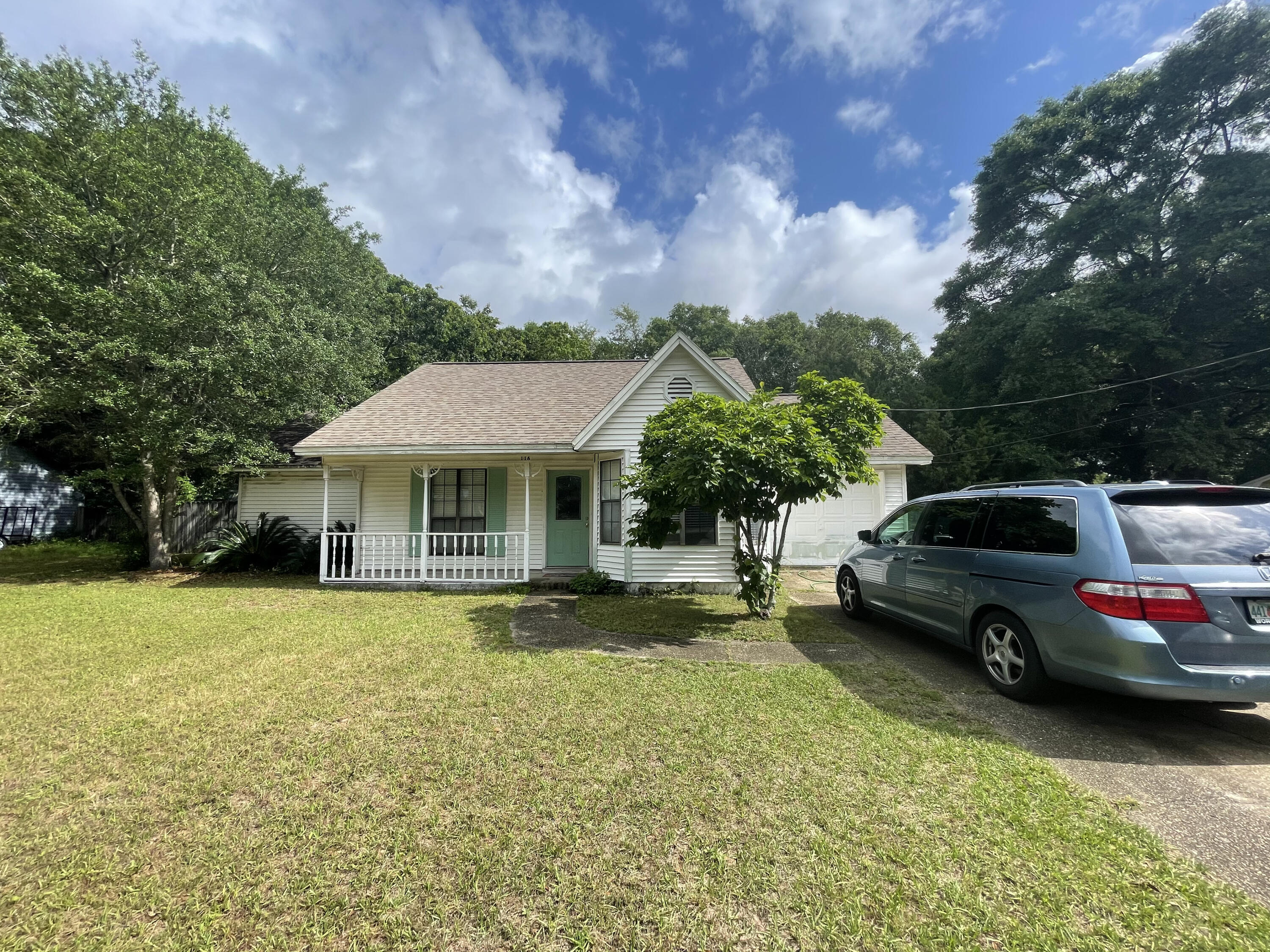 116 Springwood Circle Crestview, FL 32536 - Photo 1 of 14 a front view of a house with garden
