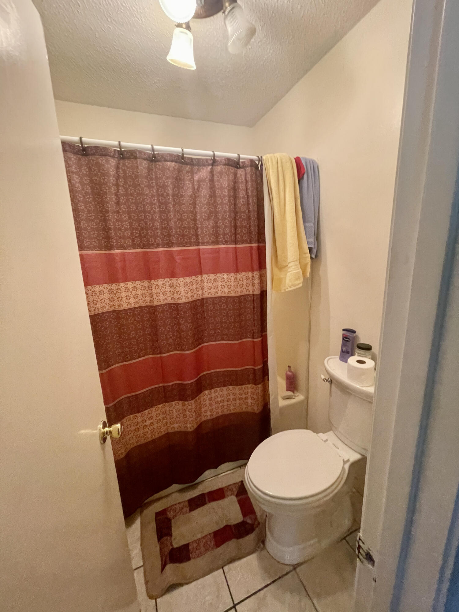 116 Springwood Circle Crestview, FL 32536 - Photo 11 of 14 a bathroom with a toilet a sink and shower