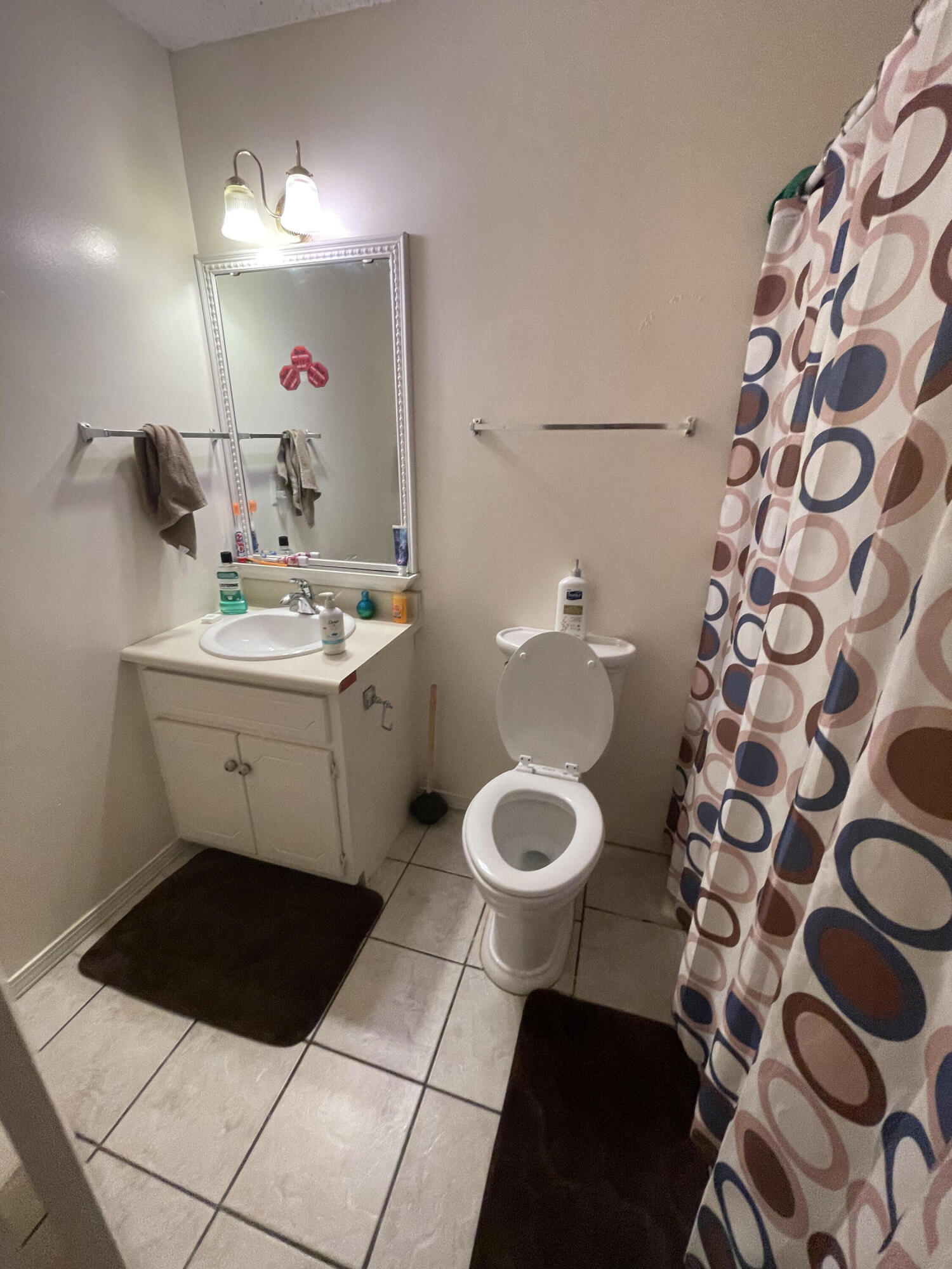 116 Springwood Circle Crestview, FL 32536 - Photo 12 of 14 a bathroom with a sink a toilet and a mirror